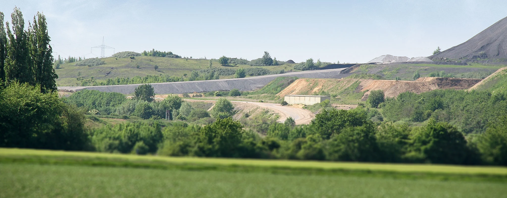Creating landfill volume by new landfill on old